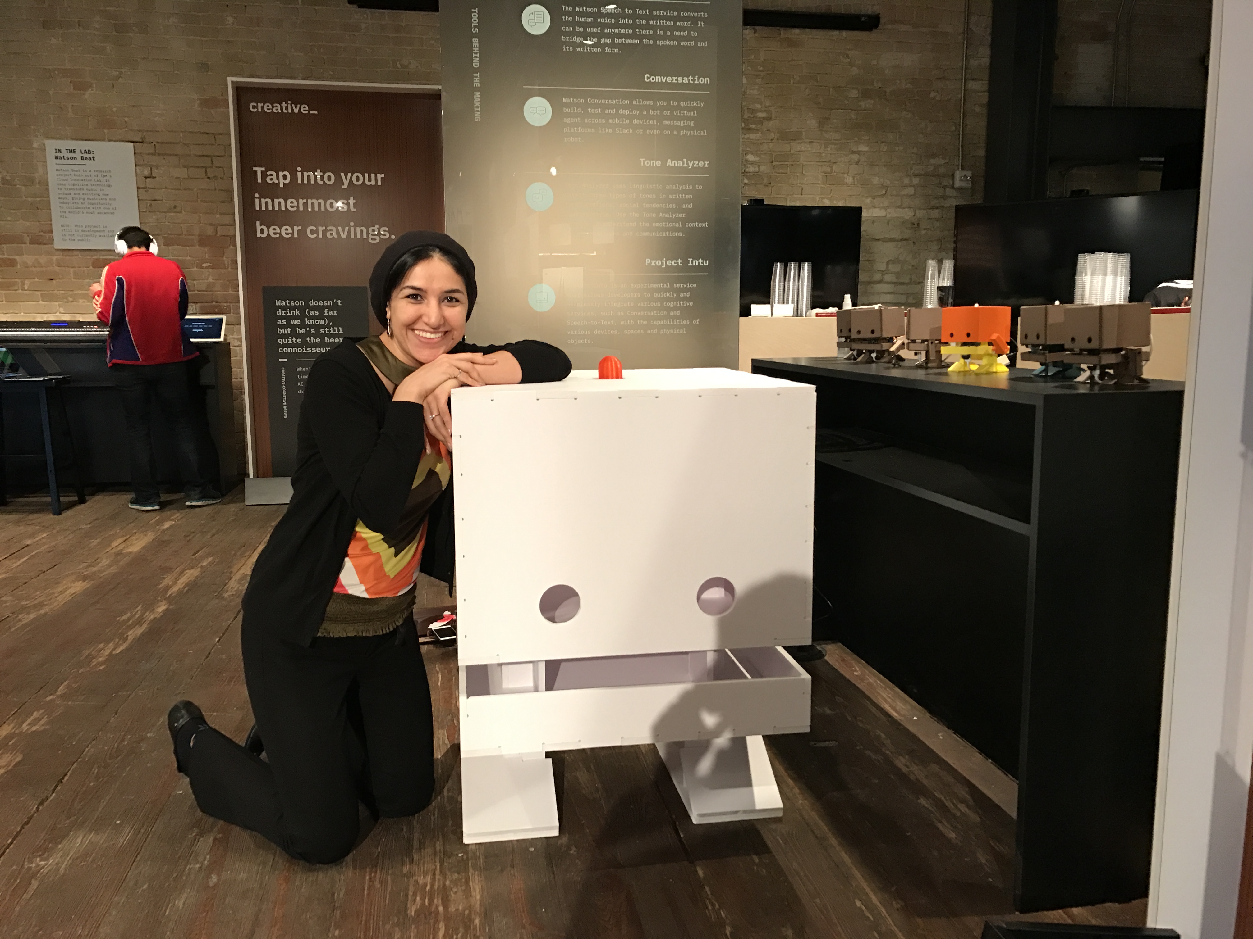 Giant TJBot posing with creator Maryam Ashoori at SXSW 2017